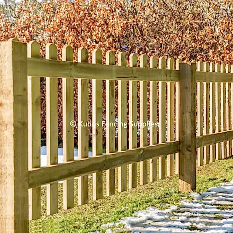 Wooden picket fence. Round top picket fencing.