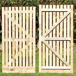 Wooden palisade gate. Garden side gates.