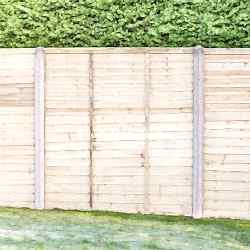 Waney edge lap panels with concrete posts.