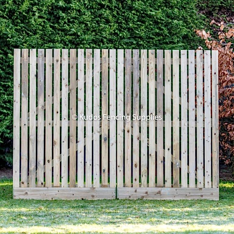 Wooden palisade driveway gates