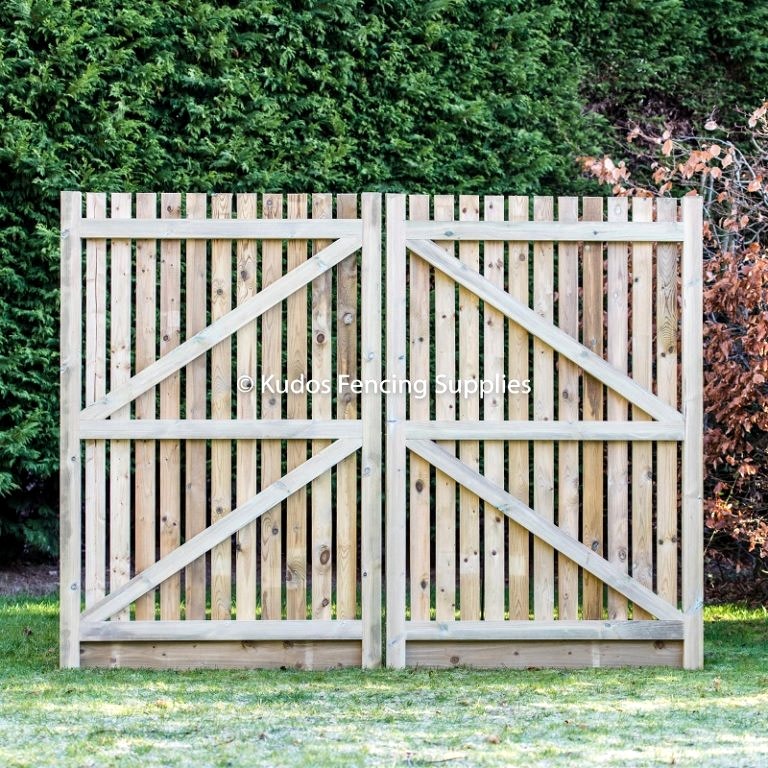 Wooden palisade driveway gate frame