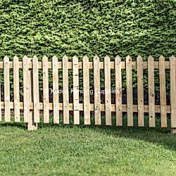 Pointed top picket fencing. Wooden picket fence.